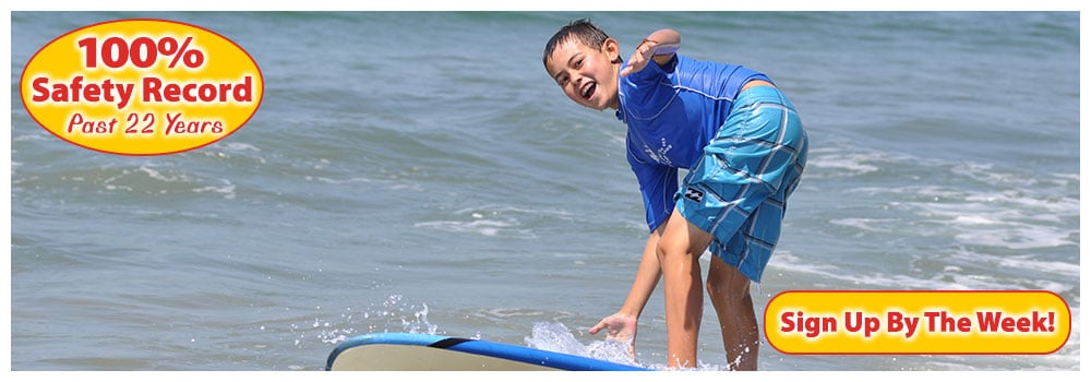 Boy on blue wakeboard in the ocean